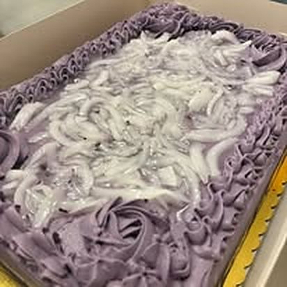 Sheet cake with purple frosting swirls